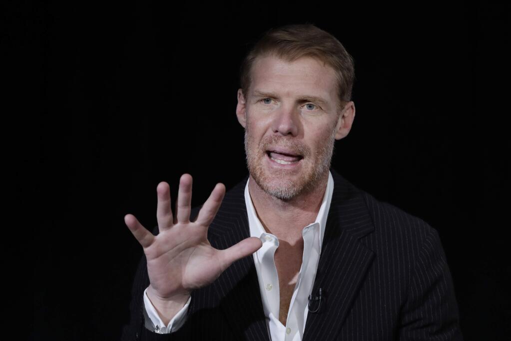 Alexi Lalas talks during an interview, Wednesday, May 30, 2018, in New York. Lalas will be part of Fox Sports coverage of the 2018 FIFA World Cup. (AP Photo/Mark Lennihan)