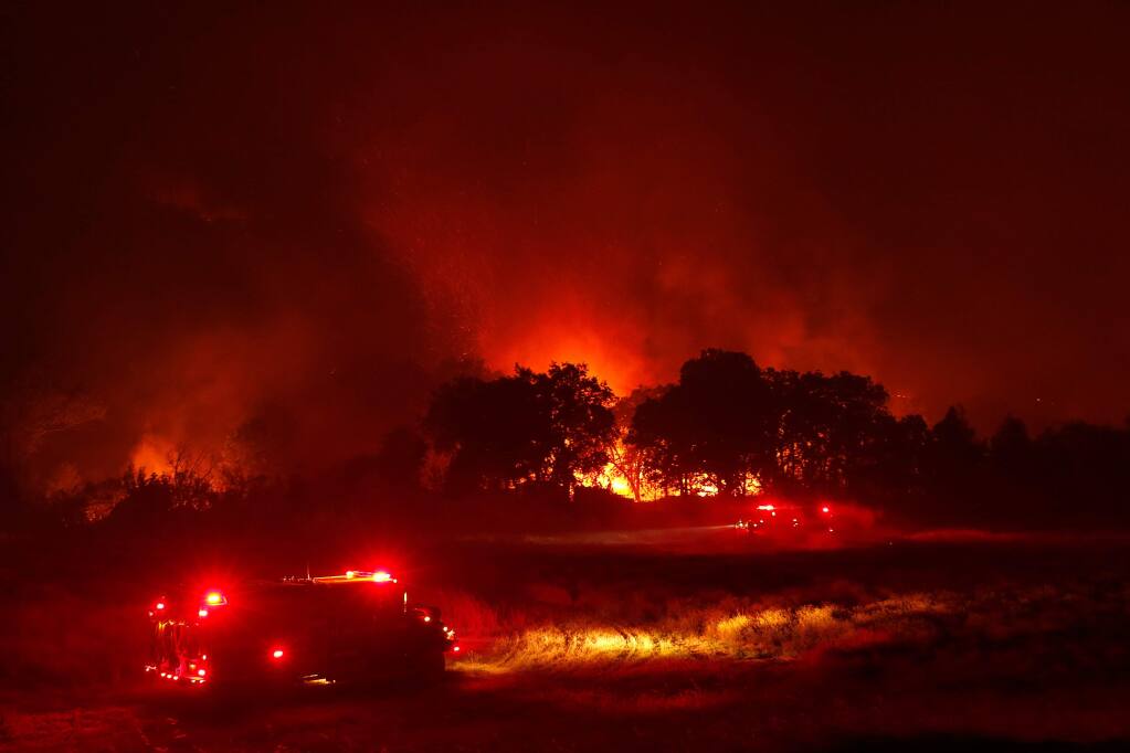 Fire crews battlethe Ranch Fire off New Long Valley Road near Clearlake Oaks, California, on Saturday, August 4, 2018. (Alvin Jornada / The Press Democrat)