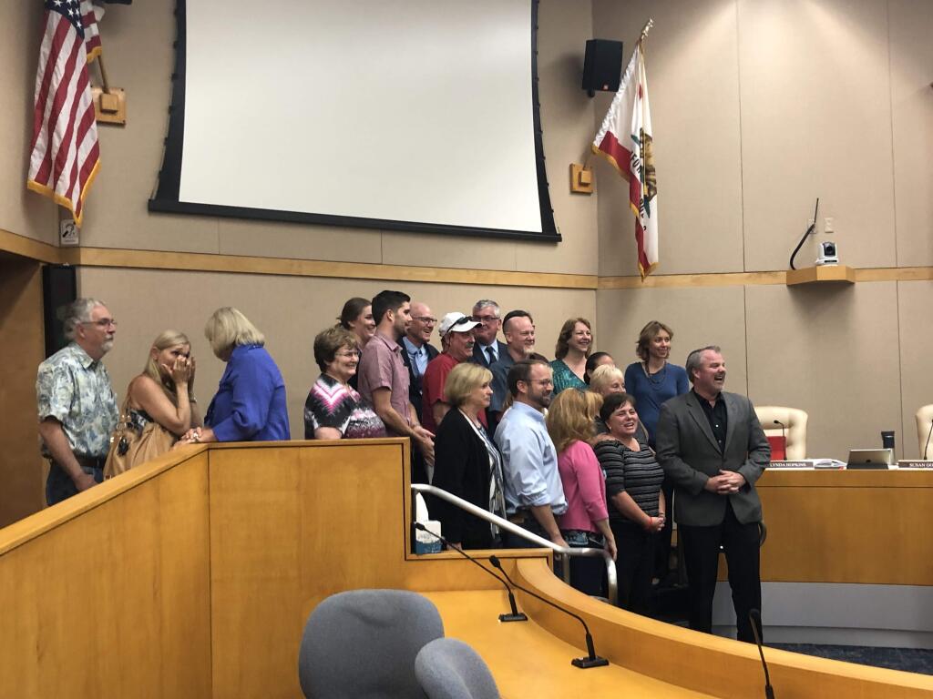 Larkfield residents pose with the Sonoma County Board of Supervsiors on Tuesday, June 5, 2018 after the board, acting as directors of the county Water Agency, authorized a financing plan to extend sewer service to the area. (JD Morris/The Press Democrat)