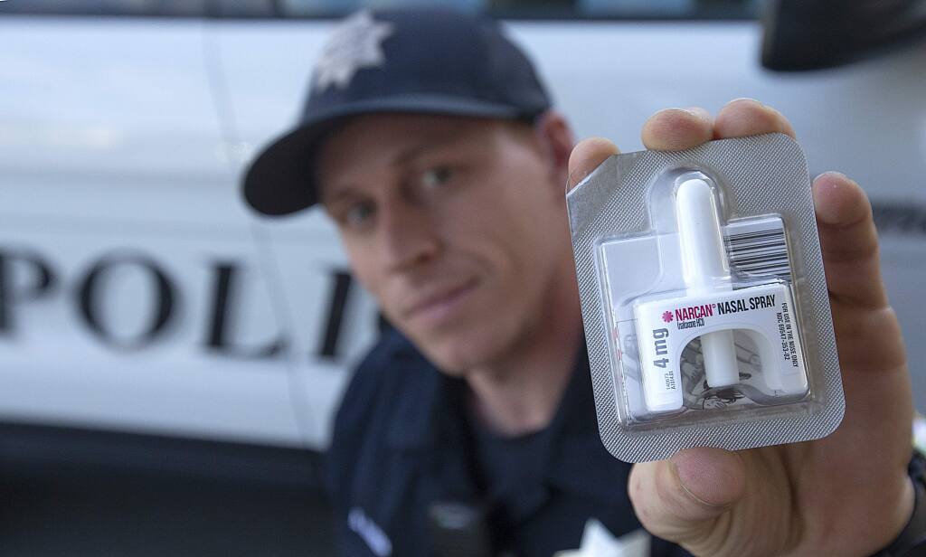 Petaluma police officer Brandon Hansen holds the new Narcan nasal spray for resuscitate opioid overdose victims. Hansen used the spray on Tuesday to revive a woman who had overdosed on heroin. (photo by John Burgess/The Press Democrat)