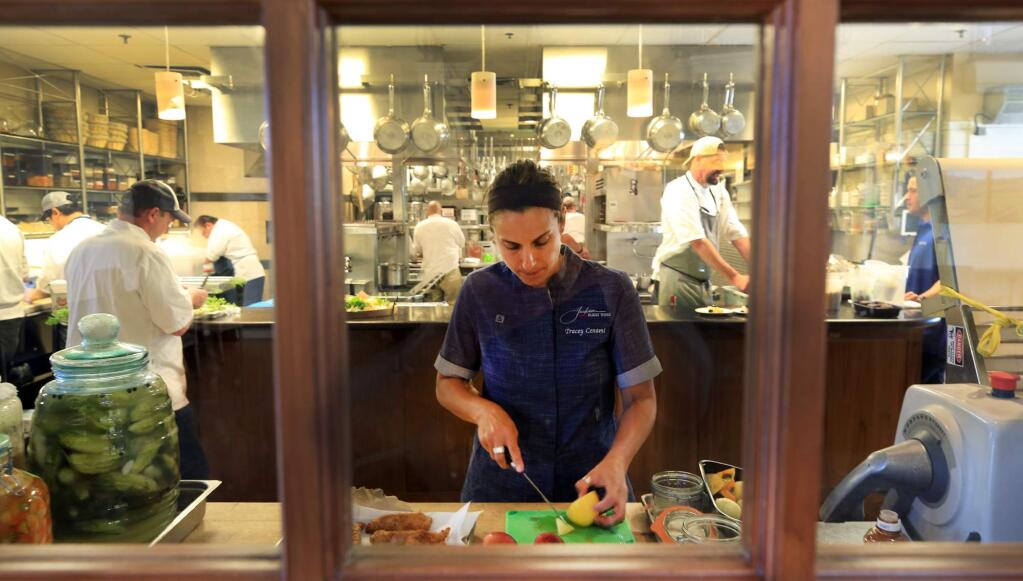 Tracey Cenami, chef at La Crema Winery, works in the Kendall Jackson kitchen, Thursday July 6, 2017 in Santa Rosa. (Kent Porter / The Press Democrat) 2017