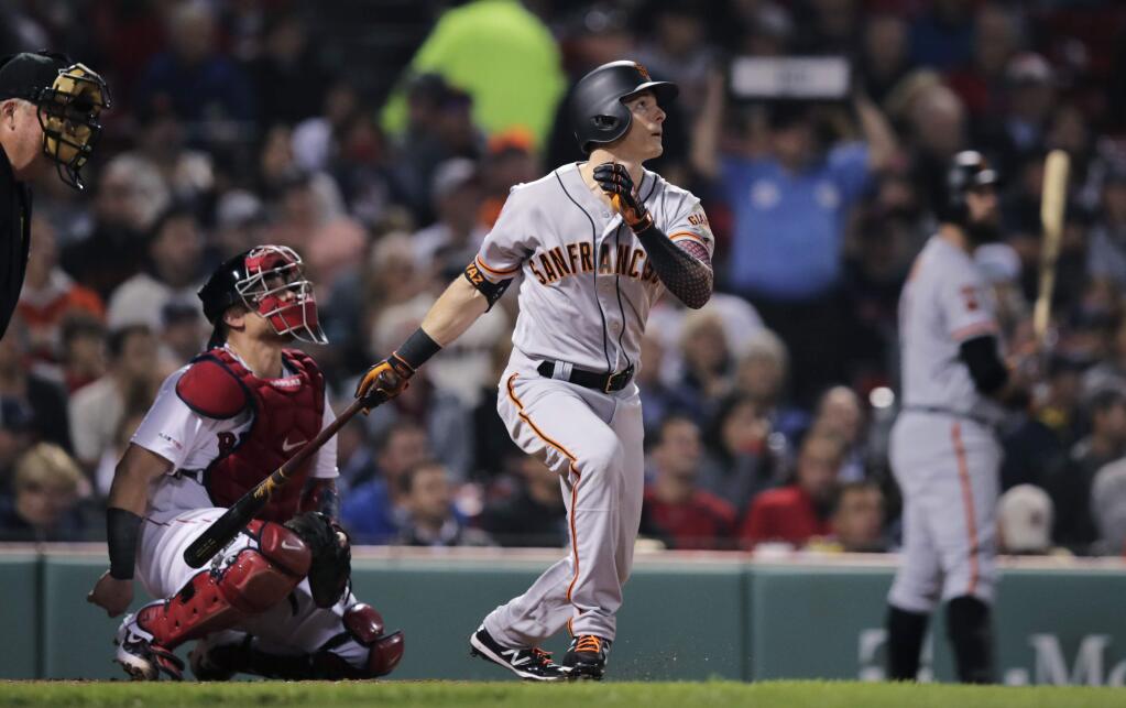 The San Francisco Giants' Mike Yastrzemski watches the flight of his solo home run in the fourth inning against the Boston Red Sox at Fenway Park in Boston, Tuesday, Sept. 17, 2019. (AP Photo/Charles Krupa)