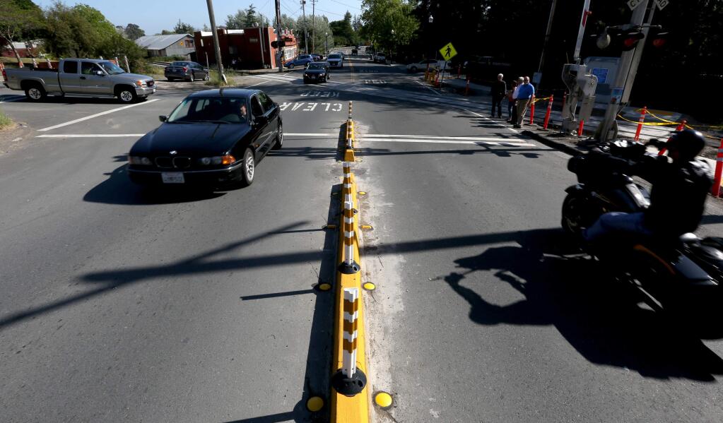 A barrier was installed on Main Street at Woodward Ave. in Penngrove, Friday, May 1, 2015. (CRISTA JEREMIASON / The Press Democrat)