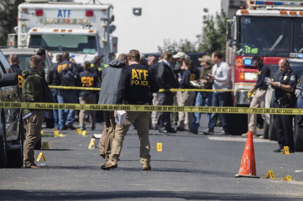 Authorities investigate an explosion at a home in Austin, Texas, Monday, March 12, 2018. Investigators believe the fatal explosion on Monday is linked to another deadly bombing elsewhere in the city this month, and they're considering whether race was a factor because all of the victims were black. (Ricardo B. Brazziell/Austin American-Statesman via AP)