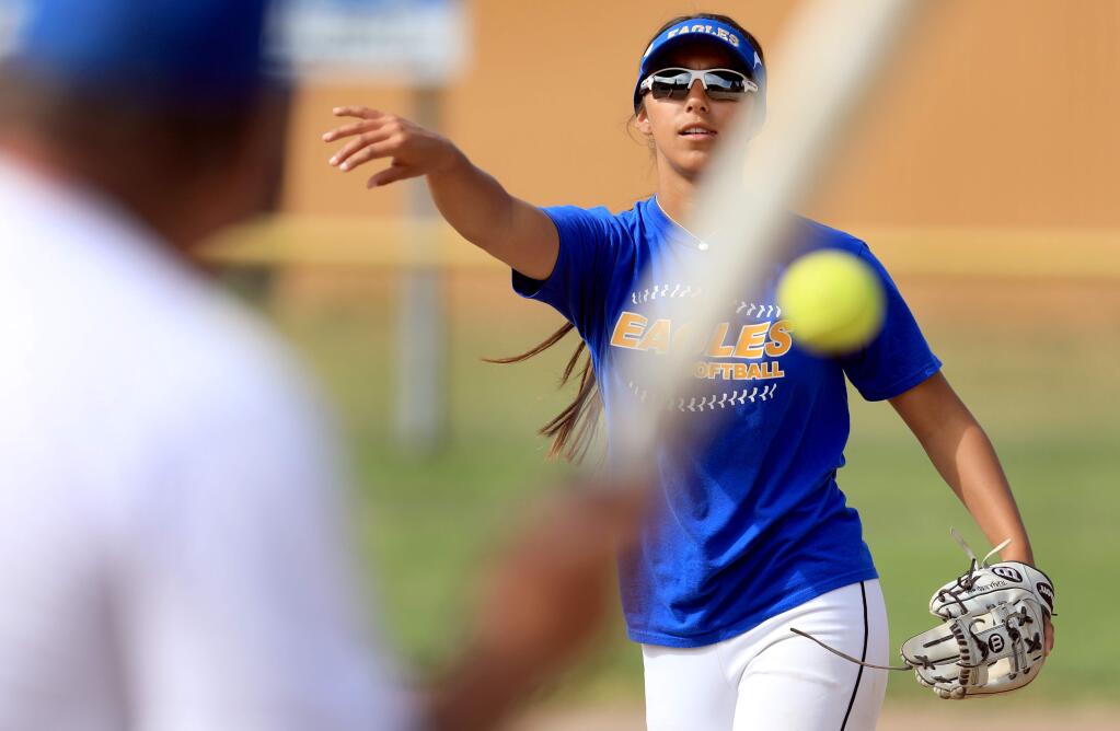 Cloverdale pitcher Tehya Bird throws during an infield drill, Monday, May 13, 2019 at Daly Field in Cloverdale. (Kent Porter / The Press Democrat)