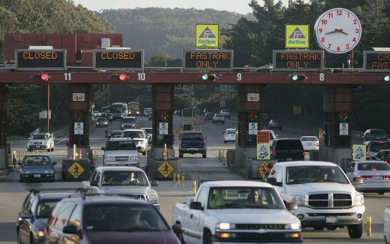 (FILE PHOTO) Drivers travel north through the toll booths from Doyle Drive in San Francisco before crossing the Golden Gate Bridge. (Kent Porter / The Press Democrat)