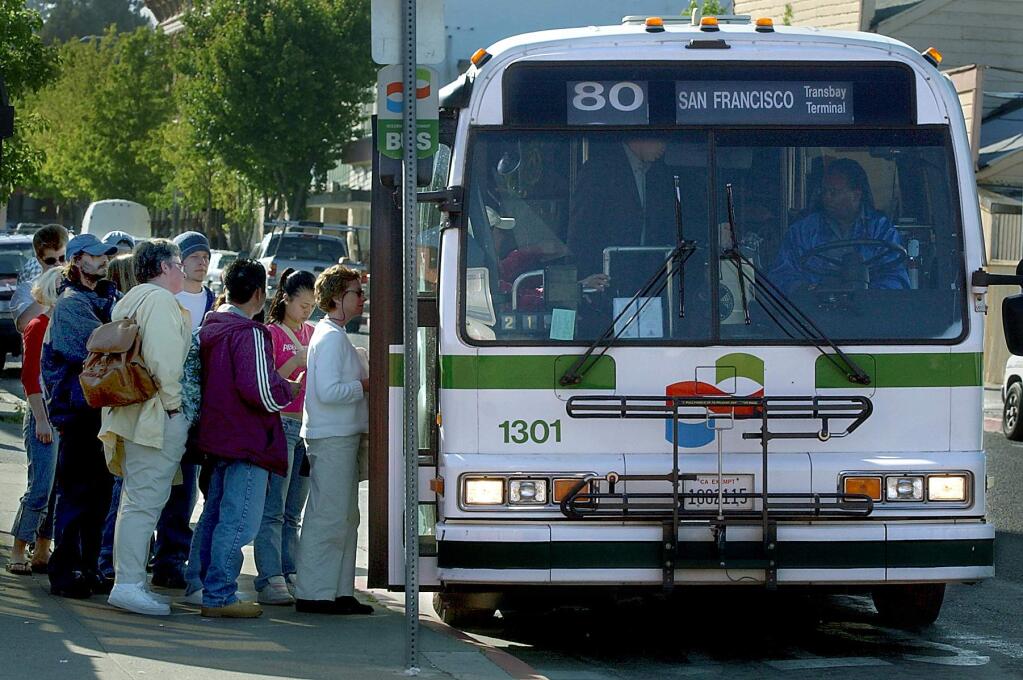 Petaluma commuters board a Golden Gate Transit bus for San Francisco. (KENT PORTER/ PD FILE, 2002)