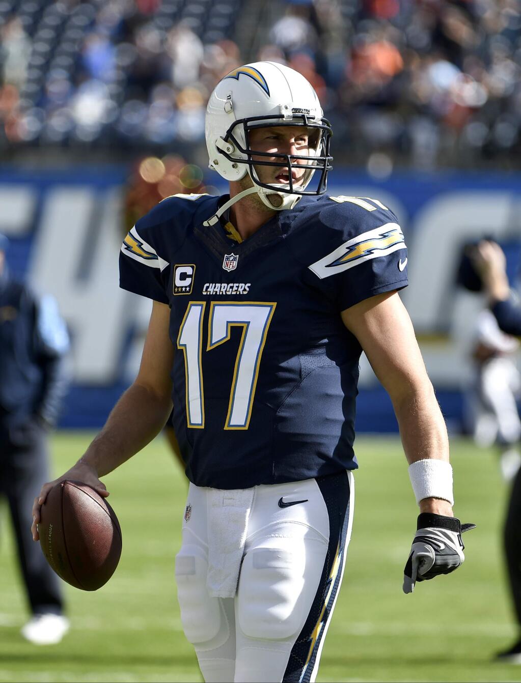 San Diego Chargers quarterback Philip Rivers warms up before an NFL football game against the Denver Broncos Sunday, Dec. 14, 2014, in San Diego. (AP Photo/Denis Poroy)