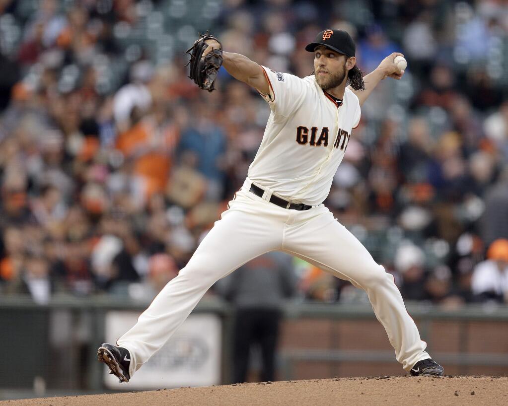 San Francisco Giants' Madison Bumgarner works against the Los Angeles Dodgers during the first inning of a baseball game Wednesday, April 22, 2015, in San Francisco. (AP Photo/Ben Margot)