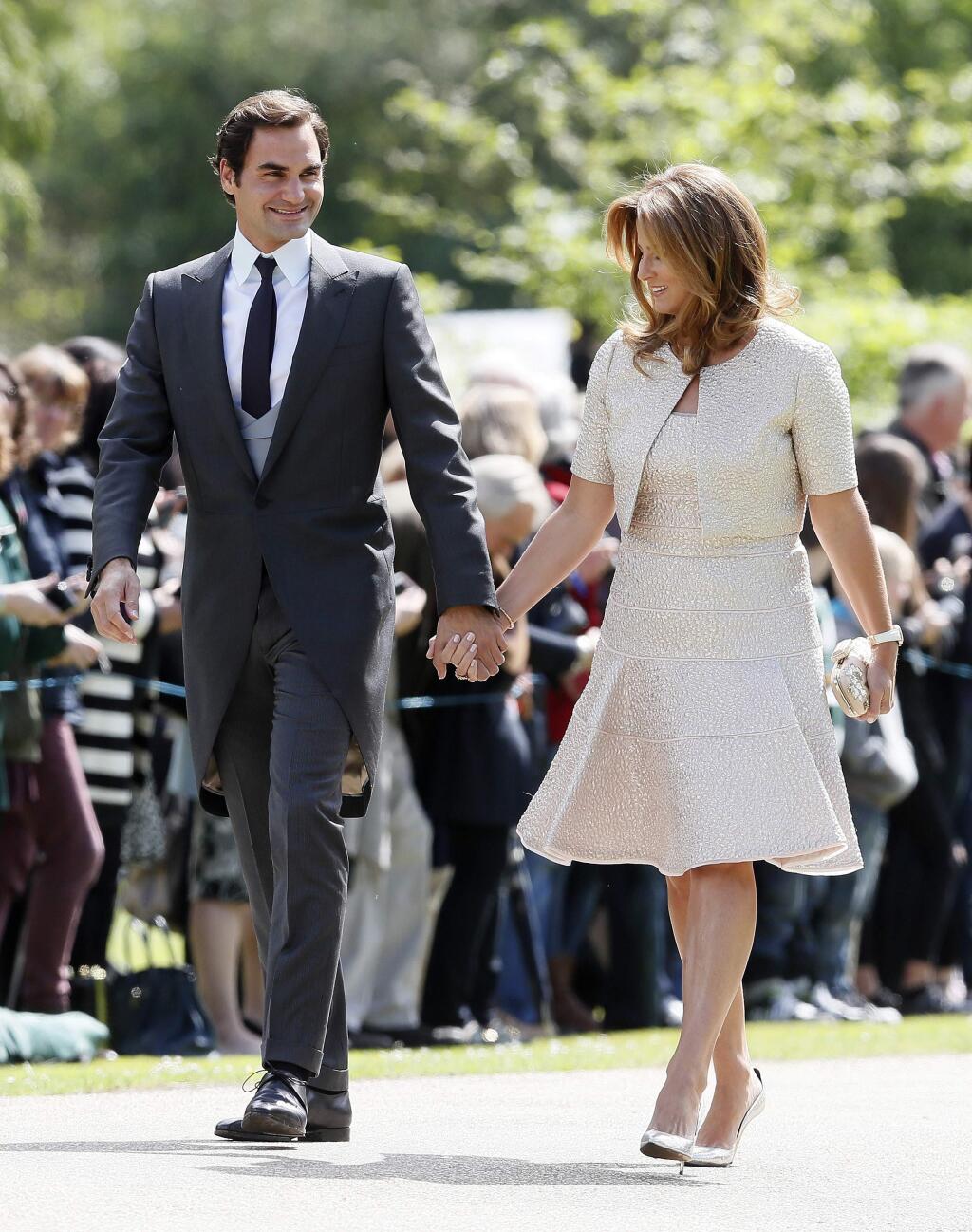 Swiss tennis player Roger Federer and his wife Mirka arrive at St Mark's Church in Englefield, England, ahead of the wedding of Pippa Middleton and James Matthews, Saturday, May 20, 2017. Middleton, the sister of Kate, Duchess of Cambridge is to marry hedge fund manager James Matthews in a ceremony Saturday where her niece and nephew Prince George and Princess Charlotte are in the wedding party, along with sister Kate and princes Harry and William. (AP Photo/Kirsty Wigglesworth, Pool)