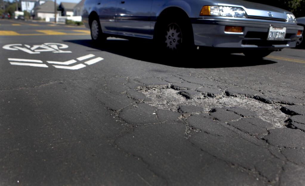 Petaluma, CA, USA. Tuesday, June 21, 2016._ A city survey asked residents about their priorities and majority of Petalumans were most concerned about potholes. (CRISSY PASCUAL/STAFF PHOTOGRAPHER)