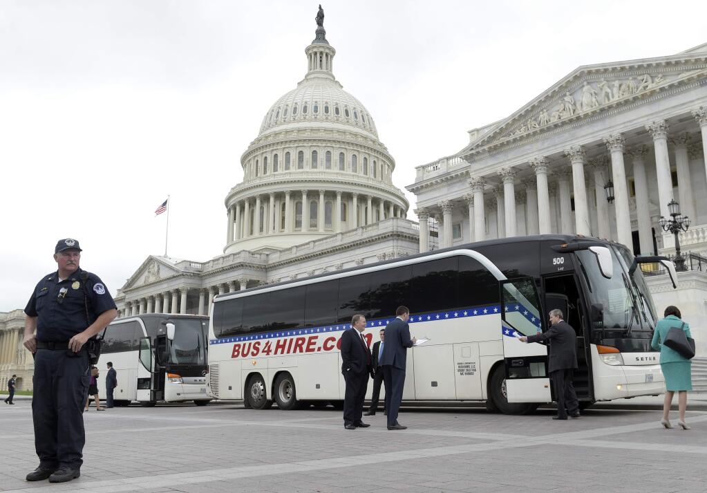 Sen. John Kennedy, R-La., second from right, boards a bus on Capitol Hill in Washington, Wednesday, April 26, 2017, heading to the White House with other Senators to get a briefing on North Korea. (AP Photo/Susan Walsh)