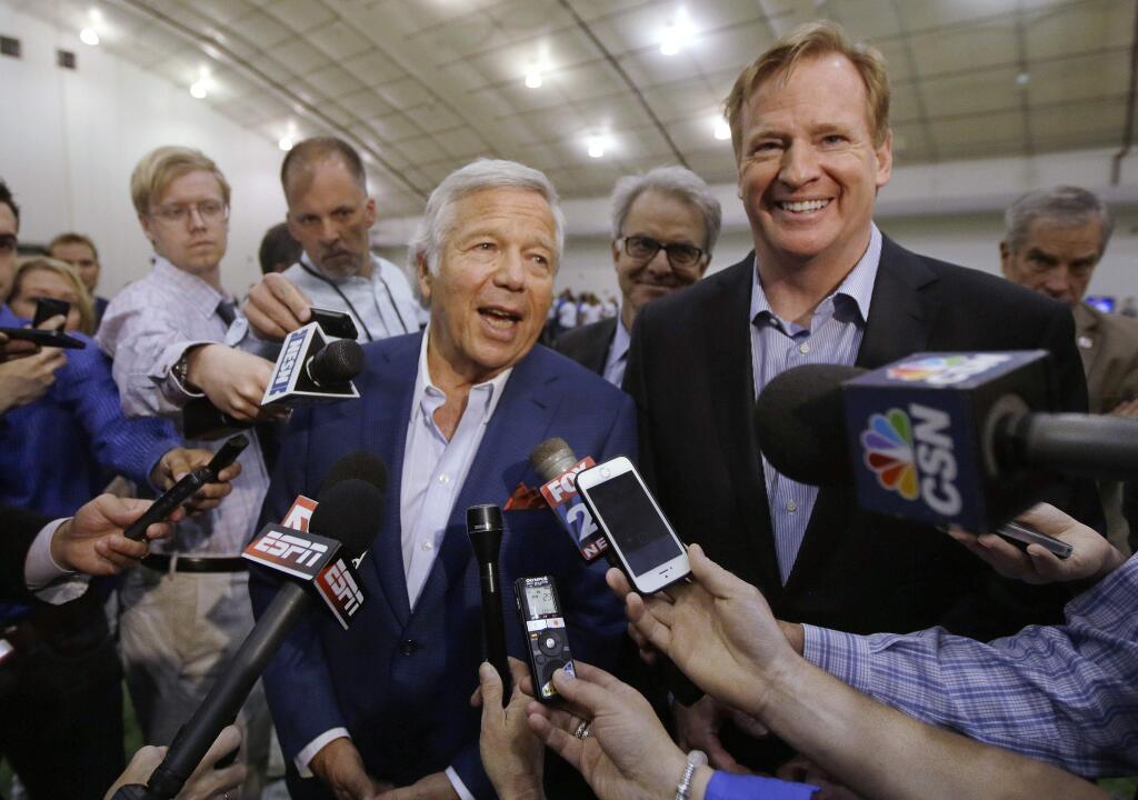 FILE - In this May 29, 2014, file photo, NFL Commissioner Roger Goodell, right, and New England Patriots owner Robert Kraft address members of the media during a football safety clinic for mothers at the team's facilities in Foxborough, Mass. Kraft and Goodell have worked closely in bringing about the league's impressive growth. That alliance was strained with the league's punishment of Tom Brady and his team in the 'Deflategate' scandal. (AP Photo/Stephan Savoia, File)