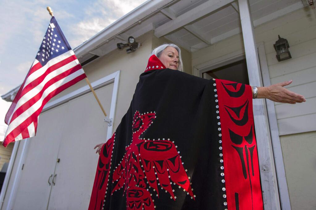 Lorrie Thomas-Dossett displays the Raven clan emblem on her 'button blanket,' a traditional Tlingit Indian ceremonial robe that she's taking to Washington, D.C. for the Women's March, Jan. 20, 2017. (Robbi Pengelly/Index-Tribune)