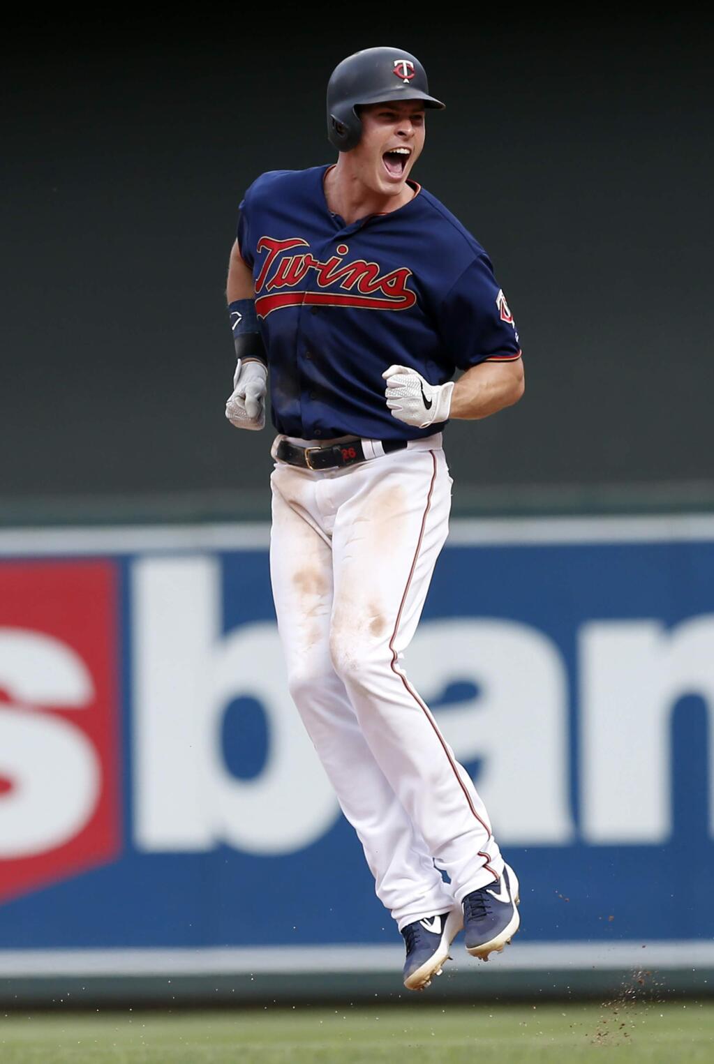 Minnesota Twins' Max Kepler celebrates his walk-off RBI single as the Twins beat the Oakland Athletics 7-6 in a baseball game Sunday, July 21, 2019, in Minneapolis. Kepler had four RBIs in the game. (AP Photo/Jim Mone)