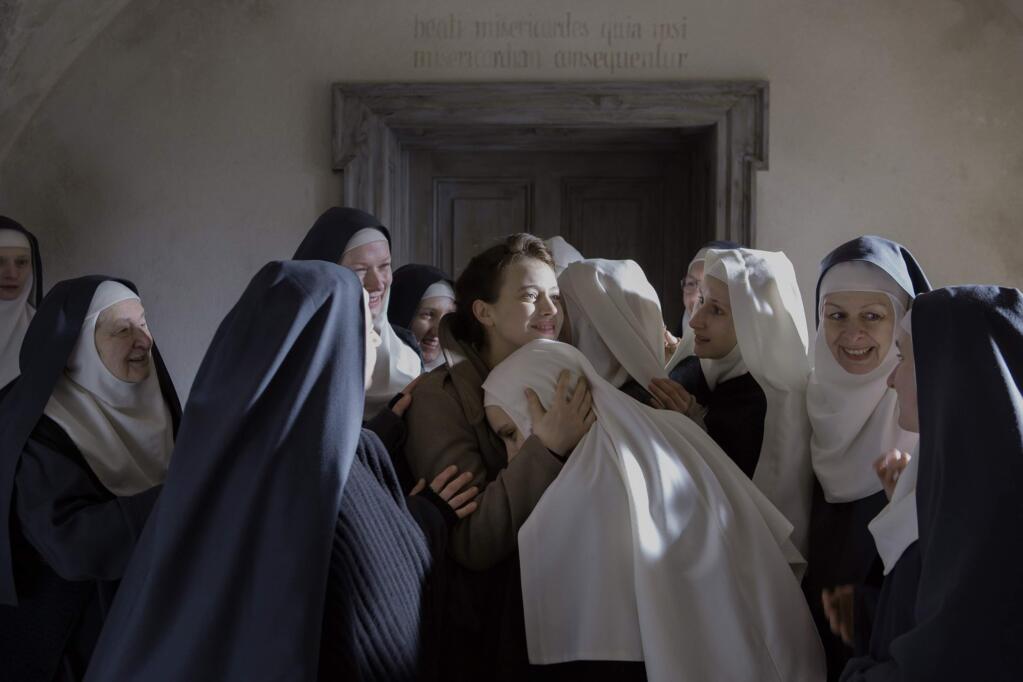 Lou de Laâge plays a doctor in postwar Poland who tends to nuns who were raped and impregnated by Soviet soldiers in “The Innocents,” a story that plays out in Vermeer-like light and shadows. (MUSIC BOX FILMS)