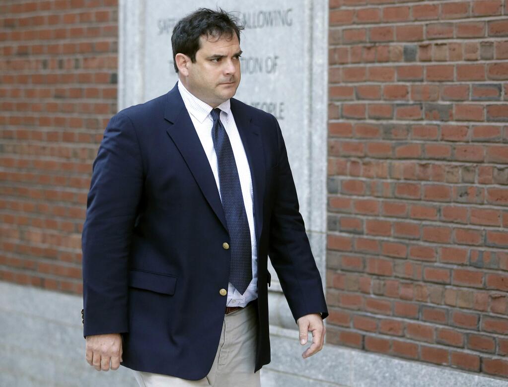 FILE - In this March 12, 2019 file photo, John Vandemoer, former head sailing coach at Stanford, arrives at federal court in Boston to plead guilty to charges in a nationwide college admissions bribery scandal. Vandemoer is scheduled to be sentenced on Wednesday, June 12, in federal court in Boston. (AP Photo/Steven Senne, File)