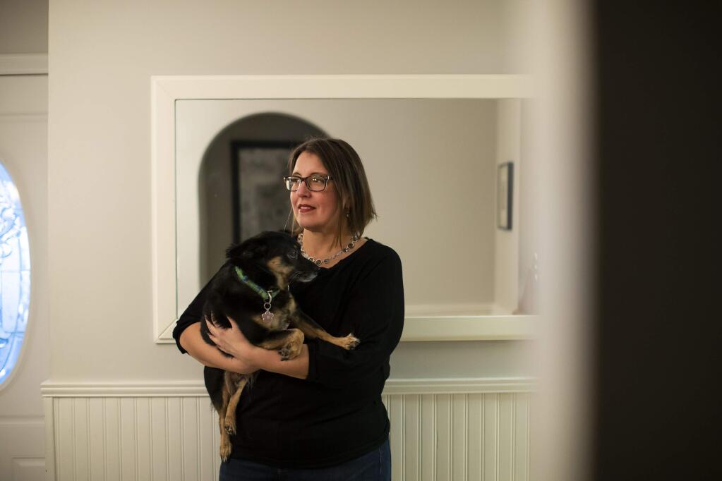 Lisa Magrin, a math teacher, with her dog Lulu in Kingston, N.Y., Nov. 20, 2018. An app on Magrin's cellphone shared her location information with other companies. The data revealed her daily habits, including hikes with her dog. (Nathaniel Brooks/The New York Times)