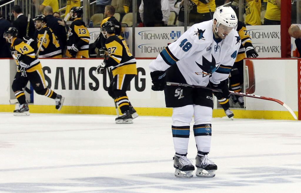 San Jose Sharks' Tomas Hertl, right, skates off the ice after the Pittsburgh Penguins defeated the Sharks 3-2 in Game 1 of the Stanley Cup final series Monday, May 30, 2016, in Pittsburgh. (AP Photo/Keith Srakocic)