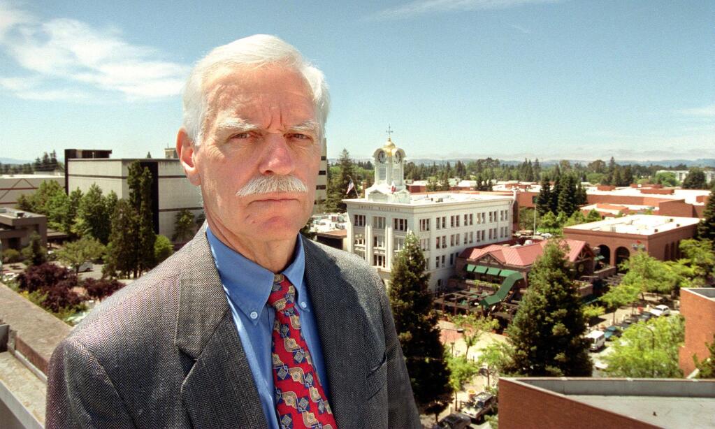 Ken Blackman played a major role in the life of Santa Rosa during his years as city manager. Here he stands atop the Rosenberg Building in downtown Santa Rosa in 2000.