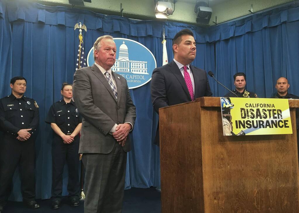 State Sen. Bill Dodd, D-Napa, and Insurance Commission Ricardo Lara?announce legislation at a Feb. 14 news conference that would allow the state to purchase insurance for fires and other disasters. (DON THOMPSON / Associated Press)