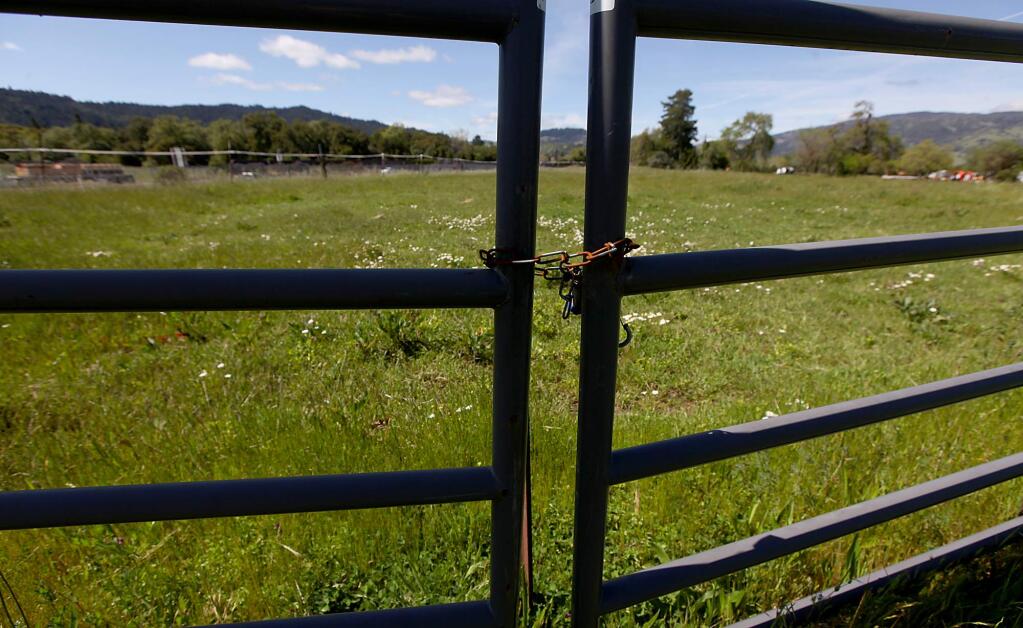 (File photo) A locked gate borders land the Cloverdale Rancheria has permission to have taken into federal trust. (Kent Porter / Press Democrat) 2012