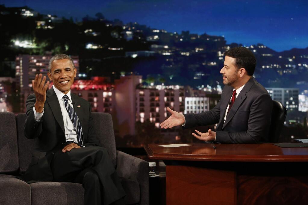This photo provided by ABC shows guest, President Barack Obama, left, and host Jimmy Kimmel during the taping of the television show, 'Jimmy Kimmel Live!,' in the Hollywood section of Los Angeles, Monday, Oct. 24, 2016. The show airs every weeknight at 11:35 p.m. EST. (Randy Holmes/ABC via AP)