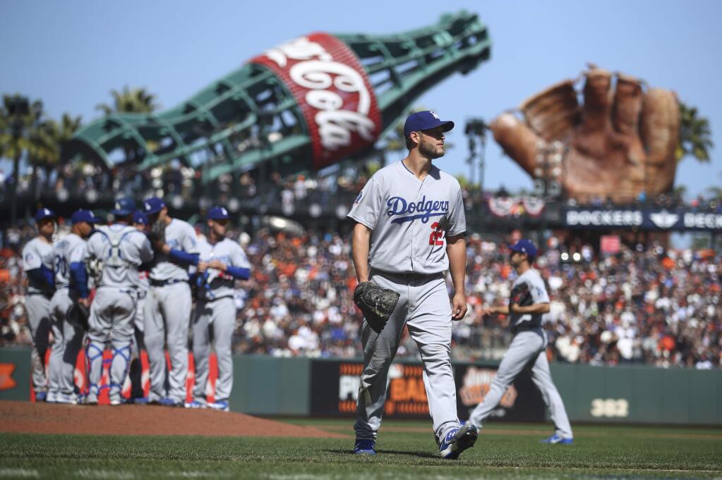 Los Angeles Dodgers pitcher Clayton Kershaw (22) walks off the field after being relieved in the eighth inning of a baseball game works against the San Francisco Giants, Sunday, April 8, 2018, in San Francisco. (AP Photo/Ben Margot)