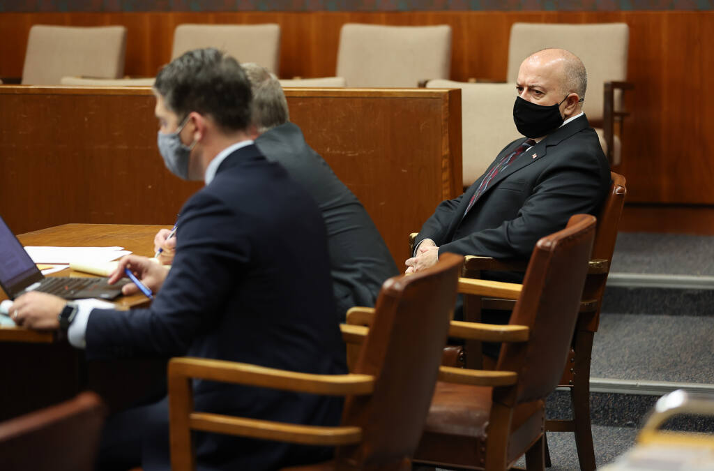 Former Sonoma County Sheriff's Deputy Charles Blount, right, appears with his defense attorneys before Judge Robert LaForge in Sonoma County Superior Court in Santa Rosa on Friday, Dec. 10, 2021. (Christopher Chung/ The Press Democrat)