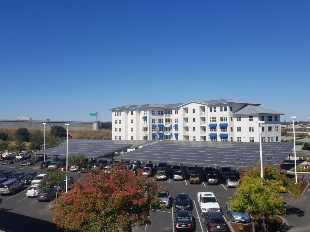 This solar carport at the Petaluma Marina development was part of a 1.44-megawatt installation at three Basin Street Properties office complexes in Sonoma and Sacramento counties. (courtesy of Energy-Producing Retail Realty)