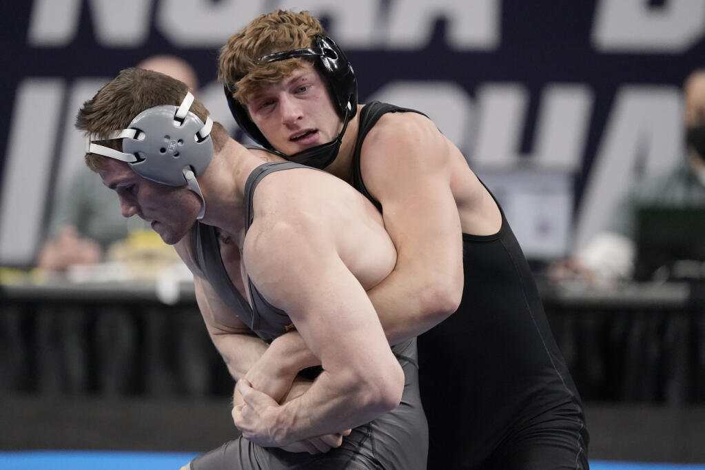 Stanford’s Shane Griffith, right, takes on Pittsburgh’s Jake Wentzel during their 165-pound match in the finals of the NCAA wrestling championships in St. Louis, in this Saturday, March 20, 2021, file photo. (Jeff Roberson / ASSOCIATED PRESS)