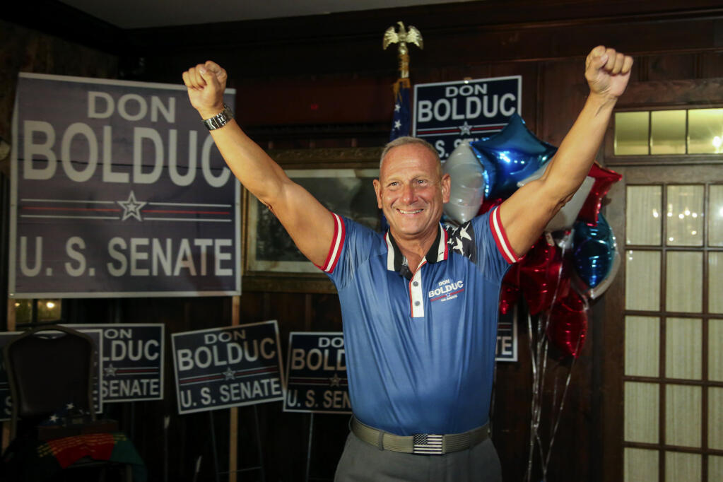 New Hampshire Republican U.S. Senate candidate Don Bolduc smiles during a primary night campaign gathering, Tuesday Sept. 13, 2022, in Hampton, N.H. (AP Photo/Reba Saldanha)