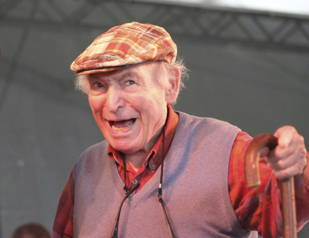FILE - In this Aug. 4, 2013, file photo, Newport Jazz Festival producer and founder George Wein appears on stage at the Newport Jazz Festival in Newport, R.I. Wein, an impresario of 20th century music who helped found the Newport Jazz and Folk festivals and set the template for gatherings everywhere from Woodstock to the south of France, died Monday, Sept. 13, 2021. He was 95. (AP Photo/Joe Giblin, File)