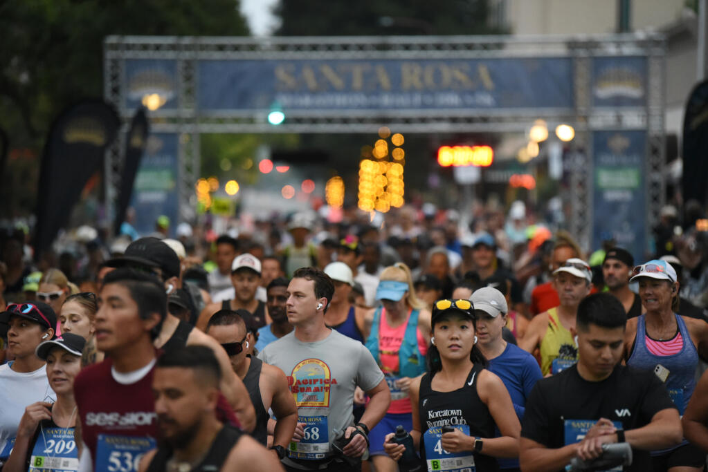 Downtown streets were filled with marathon runners at the start of the 15th annual Santa Rosa Marathon held in Santa Rosa, Sunday, Aug. 27, 2023. (Erik Castro / For The Press Democrat)