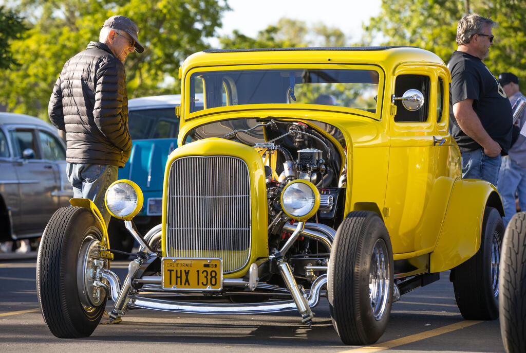 Classic car and “American Graffiti” enthusiasts check out Shawn Anderson’s 1932 Ford during Friday’s 2023 Salute to American Graffiti Car Show Cruise-In and Kickoff Social in Petaluma on May 19, 2023. (Chad Surmick / The Press Democrat)