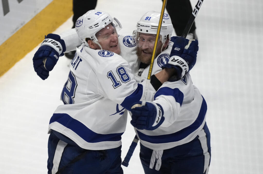 Tampa Bay Lightning left wing Ondrej Palat, left, celebrates his go-ahead goal against the Colorado Avalanche with center Steven Stamkos during the third period of Game 5 of the Stanley Cup Final on Friday, June 24, 2022, in Denver. (AP Photo/David Zalubowski)