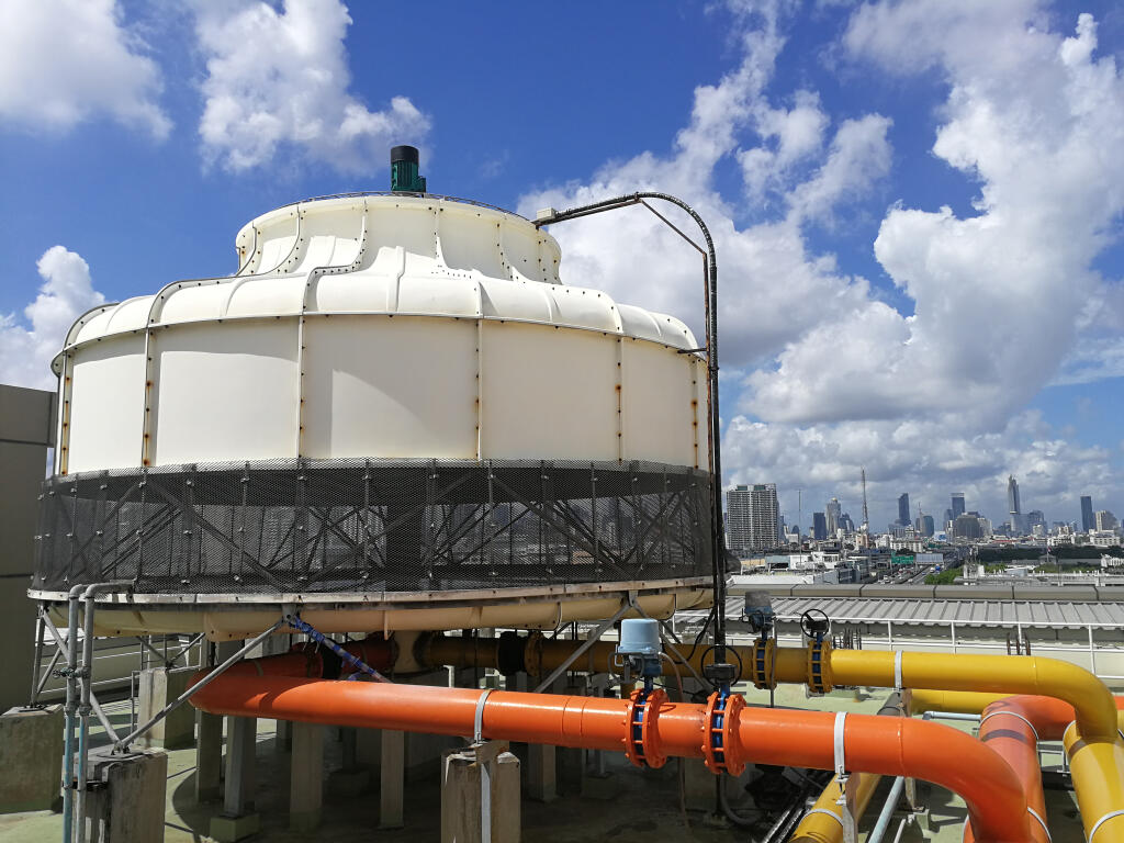 An example of a counter flow-type cooling tower at a location outside a city. (Sucharas Wongpeth / Shutterstock)