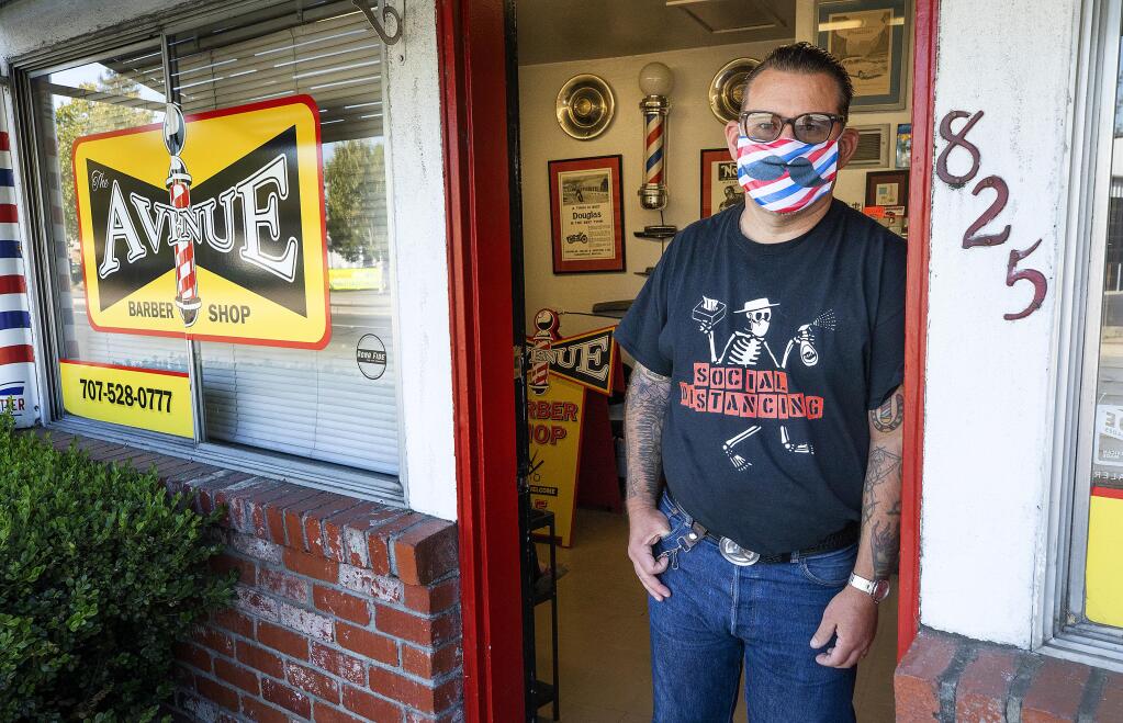 Brien Jones once again closed his Avenue Barber Shop in Santa Rosa on Tuesday, July 14, 2020, in light of the state's renewed restrictions on salons, barbers and other industries. (John Burgess / The Press Democrat)