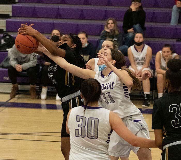 Petaluma’s Lucy Nevin battles for the basketball in the Trojans’ game against Bethel. (DWIGHT SUGIOKA / FOR THE ARGUS-COURIER)