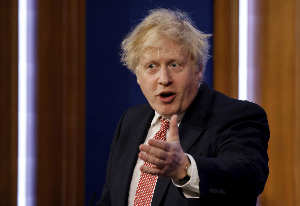 Britain's Prime Minister Boris Johnson speaks during a media briefing in Downing Street, London,  Monday Feb. 21, 2022, to outline the Government's new long-term COVID-19 plan. (Tolga Akmen/Pool via AP)
