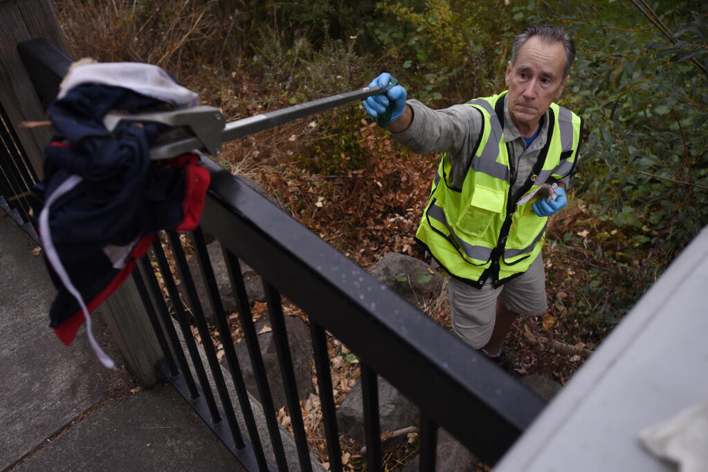 Robert Ashe, 63, spends a few hours before work, six days a week, picking up trash. He cleaned up the Prince Memorial Greenway Trail in Santa Rosa on Tuesday, Oct. 5, 2021. (Erik Castro/for The Press Democrat)