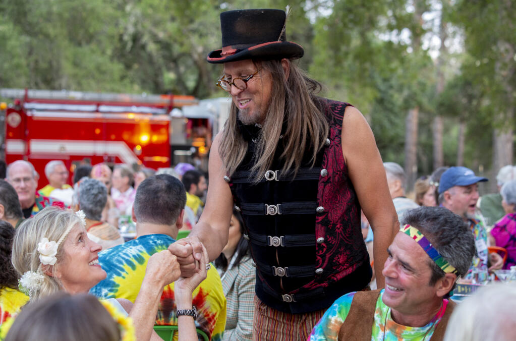 Event organizer Marcelo Defreitas greeted everyone at every table at Noche in the Summer of Love on Saturday, August 7, 2021. (Photo by Robbi Pengelly/Index-Tribune)