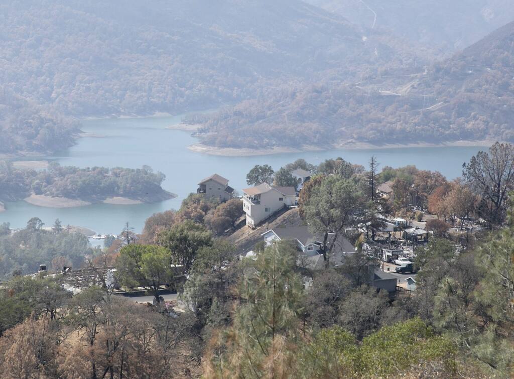 Homes destroyed by the LNU Lighting Complex Fire are interspersed with untouched homes above Lake Berryessa, a resort area and water supply reservoir, on Sept. 21, 2020. After the fire in August, residents were advised not to drink or boil the tap water because of concerns about benzene and other contaminants. (Photo by Anne Wernikoff for CalMatters)