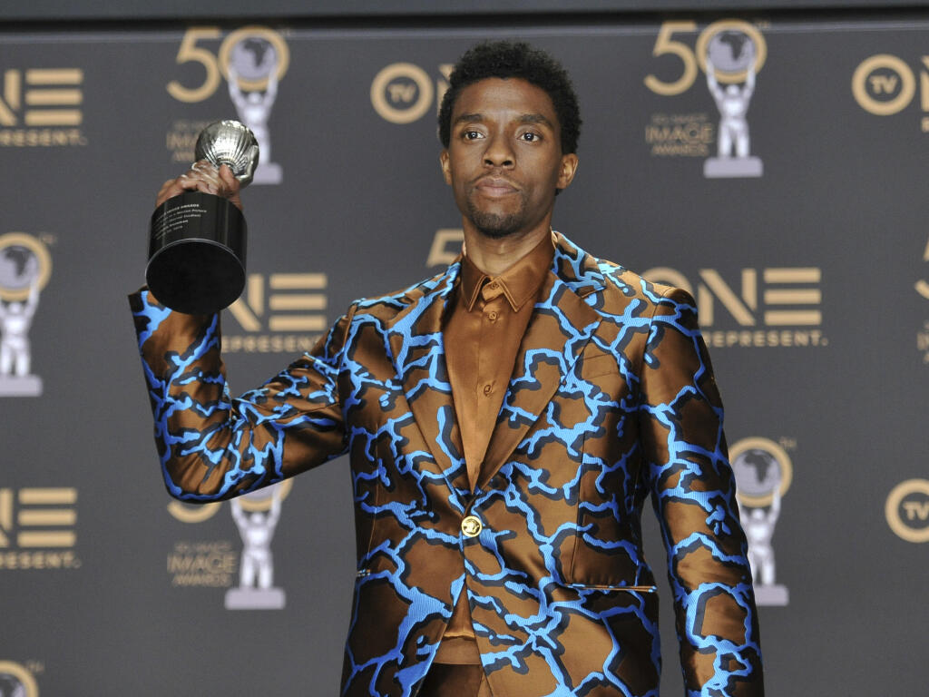 FILE - In this Saturday, March 30, 2019 file photo, Chadwick Boseman poses in the press room with the award for outstanding actor in a motion picture for "Black Panther" at the 50th annual NAACP Image Awards at the Dolby Theatre in Los Angeles. Actor Chadwick Boseman, who played Black icons Jackie Robinson and James Brown before finding fame as the regal Black Panther in the Marvel cinematic universe, has died of cancer. His representative says Boseman died Friday, Aug. 28, 2020 in Los Angeles after a four-year battle with colon cancer. He was 43. (Photo by Richard Shotwell/Invision/AP, File)
