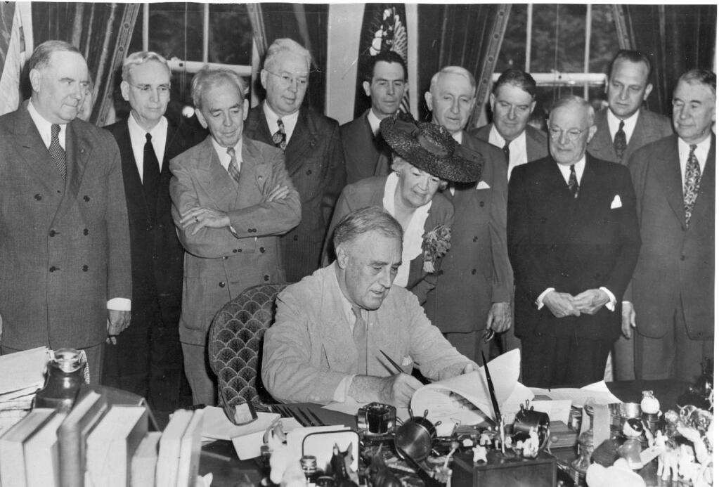 Franklin Delano Roosevelt signing the G.I. Bill into law. (COURTESY OF THE FDR MUSEUM)