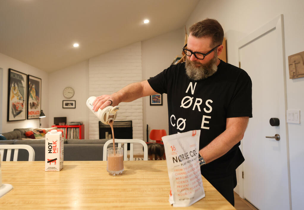 Smári Ásmundsson, founder and CEO of Nørse Cøde, demonstrates how to make a shake with his plant protein powder in Petaluma on Wednesday, March 27, 2024. (Christopher Chung/The Press Democrat)