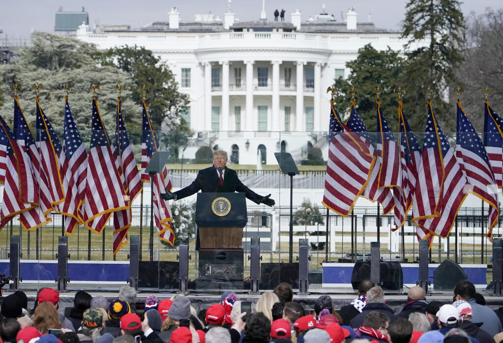 FILE - The White House in the background, President Donald Trump speaks at a rally in Washington, Jan. 6, 2021.  (AP Photo/Jacquelyn Martin, File)