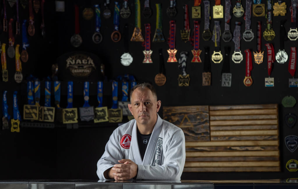 Jiu-Jitsu teacher Peter Rumble at the Rohnert Park Gracie Barra facility appeared about a year ago in a film called “Survivors” and has been experiencing positive change since sharing his story and appearing in the film. May 4, 2023. (Chad Surmick / The Press Democrat)