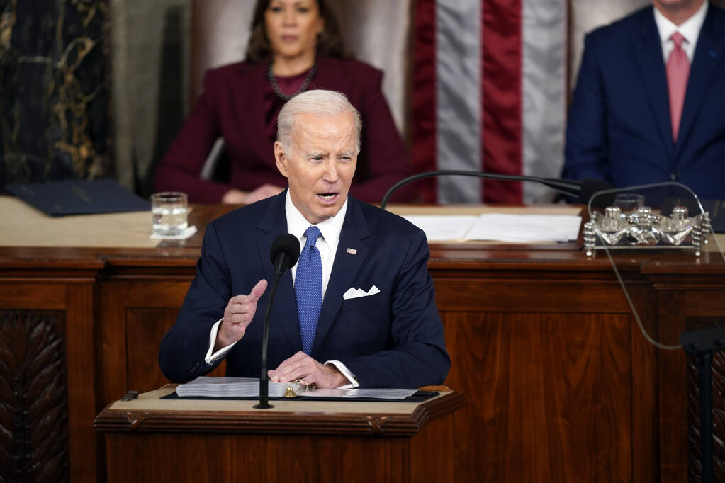 President Joe Biden delivers the State of the Union address to a joint session of Congress at the U.S. Capitol, Tuesday, Feb. 7, 2023, in Washington. Vice President Kamala Harris looks on. (AP Photo/Patrick Semansky)