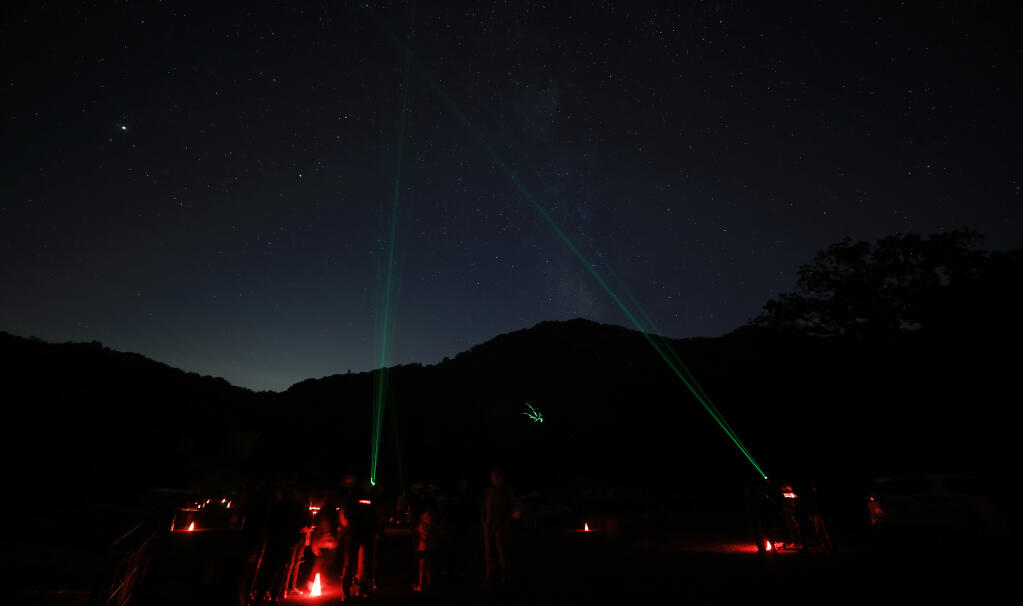 Laser pointers are used to point out different planets and constellations during a Public Star Party at the Ferguson Observatory in Sugarloaf Ridge State Park, Saturday, Sept. 25, 2021.   (Kent Porter / The Press Democrat) 2021